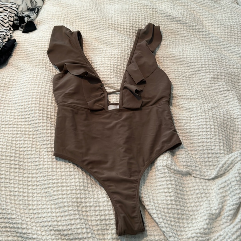 Brown suit. Padded wore once.